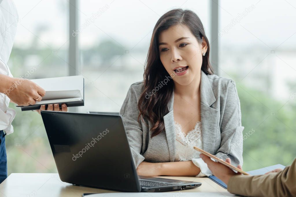 asian attractive mature businesswoman working on laptop presen work in office.
