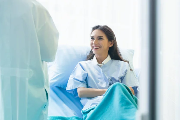 Happy patient woman discussing something health care in room of hospital, health care concept.