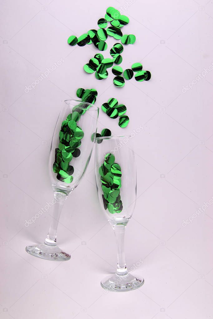 It's party time! Two champagne glasses with sparkling decorations.