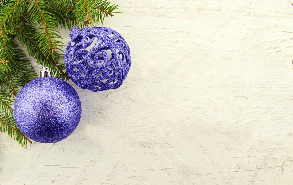 It's Christmas time! Holiday  glittering decorations and Christmas tree on a white wooden background.