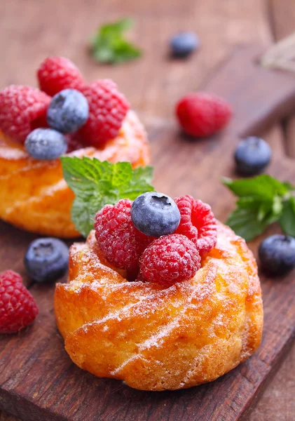 cakes with raspberries and blueberries