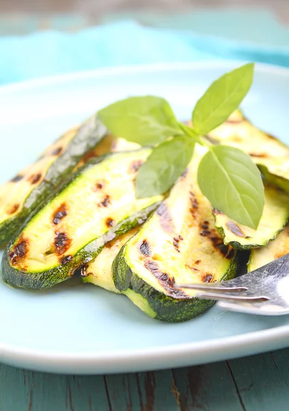 Zucchini grilled on blue plate — Stock Photo, Image