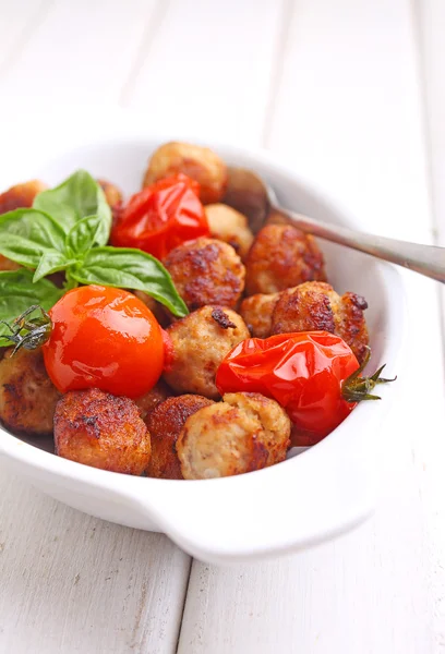 Meatballs with tomatoes on white plate — Stock Photo, Image