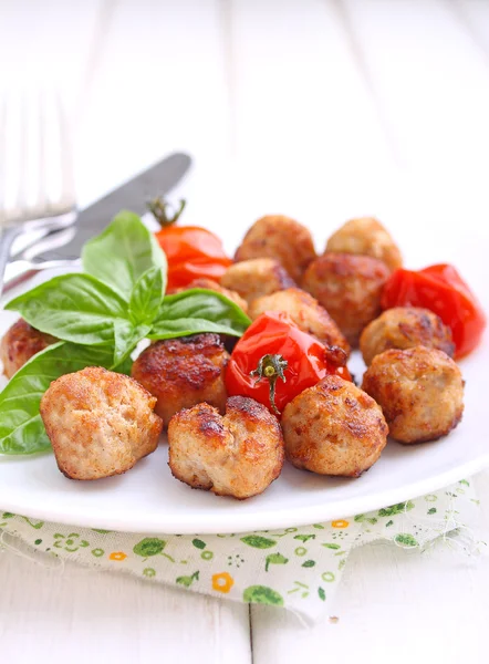 Meatballs with tomatoes on white plate — Stock Photo, Image