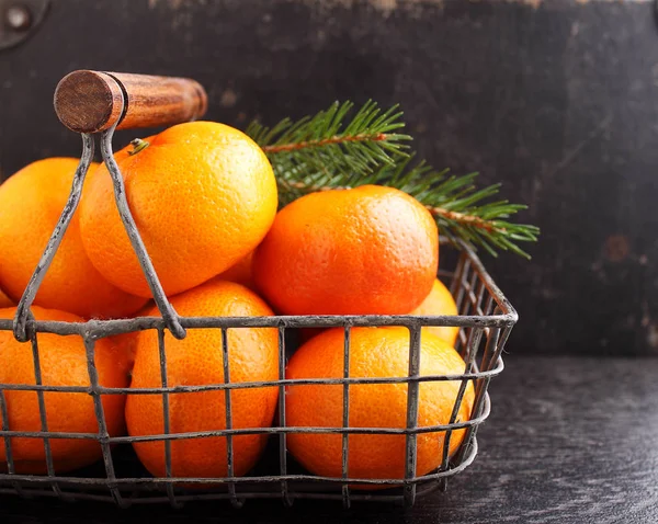 Tangerines in metal basket — Stock Photo, Image
