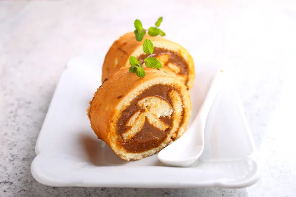 Swiss roll with condensed milk — Stock Photo, Image