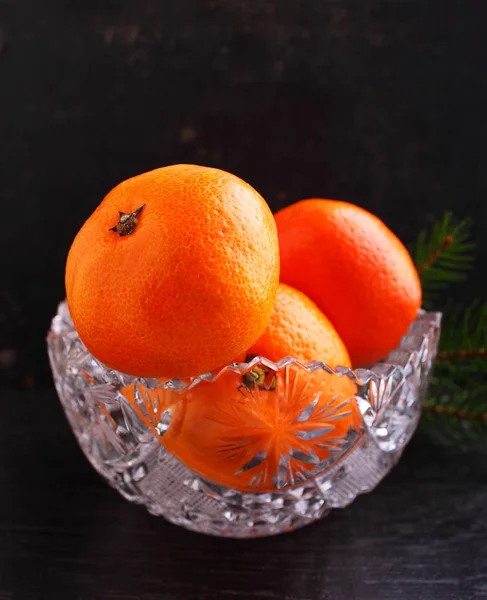 Tangerines in a crystal vase — Stock Photo, Image