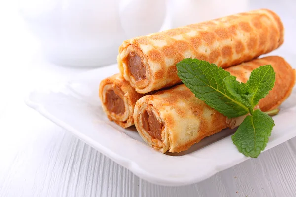 Wafer rolls with condensed milk — Stock Photo, Image