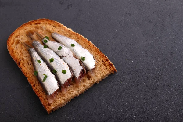 Sandwich with sprats and onion — Stock Image Sandwich with sprats and onion Stock Photo