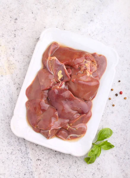 Raw chicken liver on plate — Stock Photo, Image