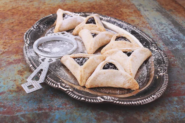 Triangle biscuits with jam served on vintage tray