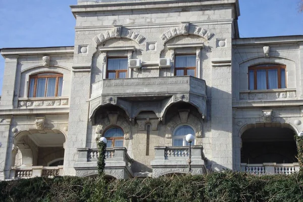 Ancient Building Made Light Limestone Balconies Arches Green Hedge Street — 스톡 사진