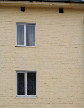  Two standard windows on the wall and two small openings under the roof      