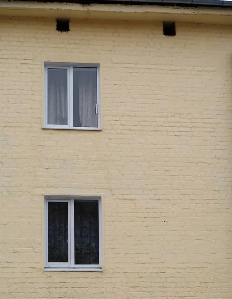  Two standard windows on the wall and two small openings under the roof      
