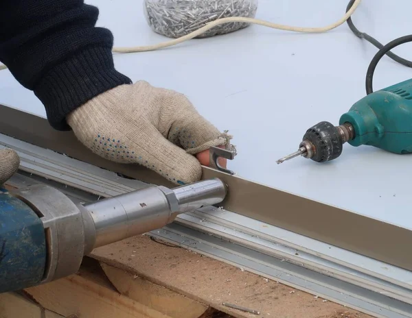 Work with an electric drill and a pneumatic tool