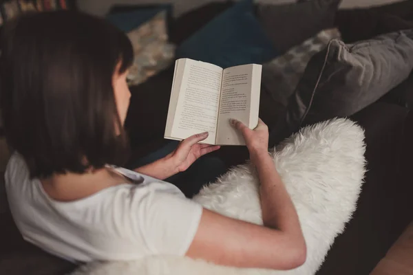 stock image beautiful woman reading a book at home