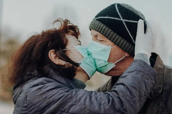 Couple Two Seniors Kisses Each Other Throught Facial Masks Outdoor — Stock Photo, Image