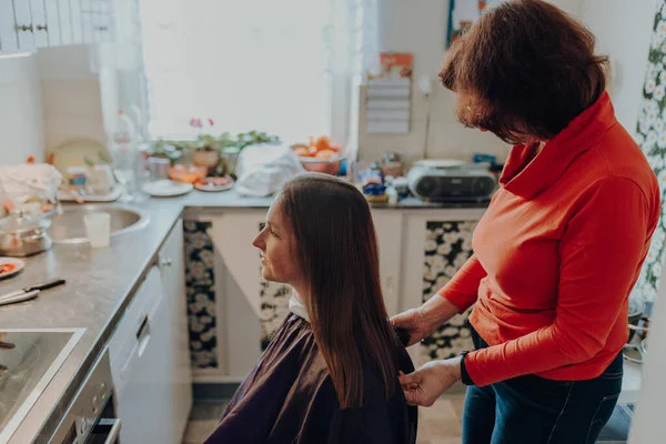 Mature Woman Cuts Hair Young Woman Long Hair Home Because Stock Image