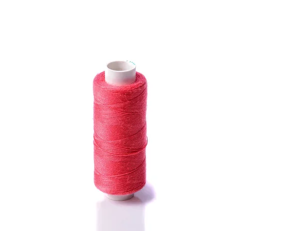Colorful bobbin thread on white background — Stock Photo, Image