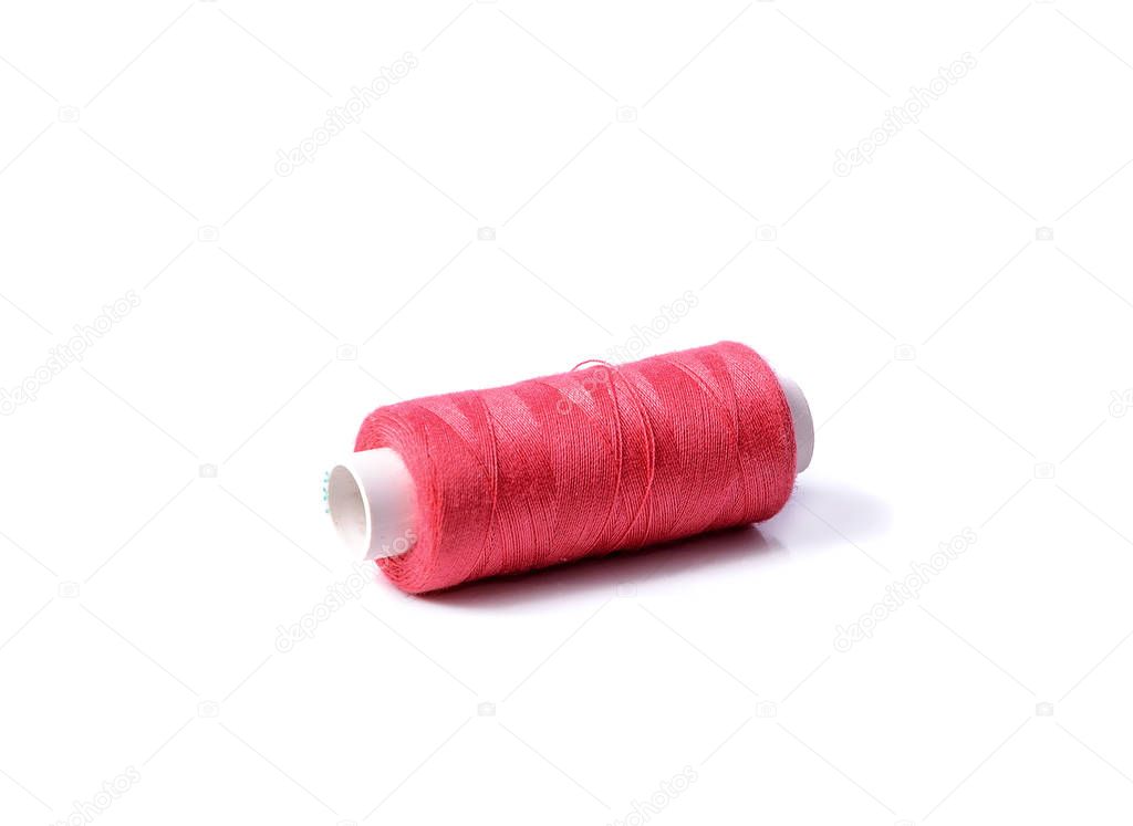 Colorful bobbin thread on white background