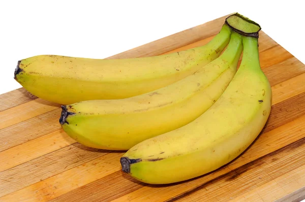 Fresh yellow bananas on a wooden Board for cutting — Stock Photo, Image