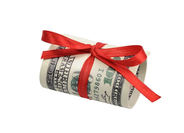 Bunt räkningar hundra dollar bundna med ett rött band. Dollar som isolerad på vit bakgrund Royaltyfria Stockfoton
