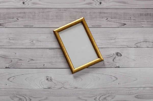 Frame for photography on a light, vintage wooden background