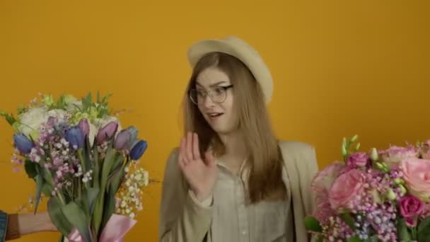 Excited girl in glasses looking at flowers with smile — Stockvideo