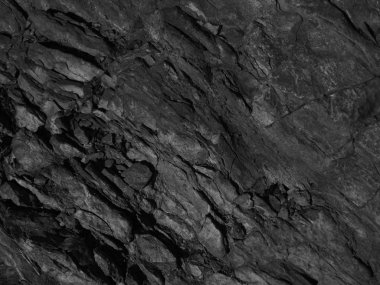 Siyah dağ dokusu. Yakın plan. Koyu gri grunge arka planı. Taş zemin. Siyah beyaz arka plan. Tek renkli kaya dokusu.