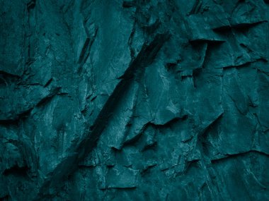             Yeşil mavi soyut arkaplan. Grunge 'un geçmişi. Tonlanmış kaya dokusu. Kaba bir dağ yüzeyi ile mavi renklerin birleşimi.                   