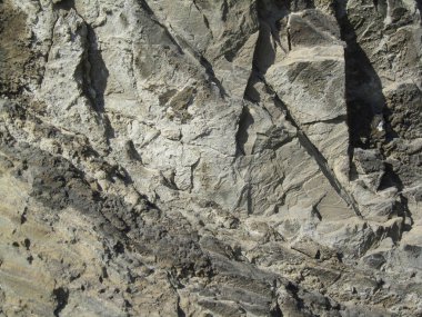 Taş zemin. Tasarımınız için sert taş yüzeyli Grunge arkaplanı. Gri kahverengi kaya dokusu. Ayrıntı.