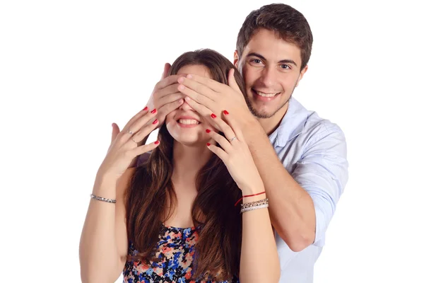 Boyfriend covering eyes of his girlfriend. Stock Image