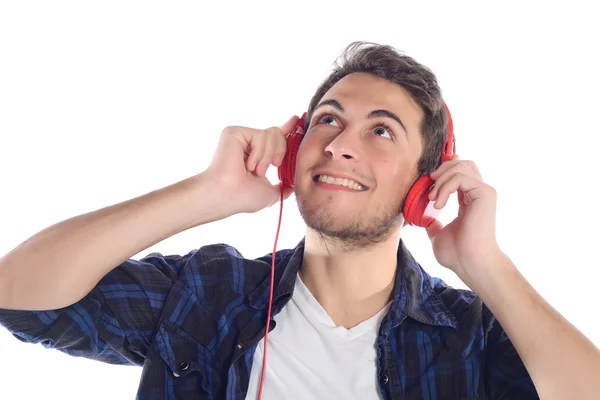 Pria latin muda mendengarkan musik — Stok Foto