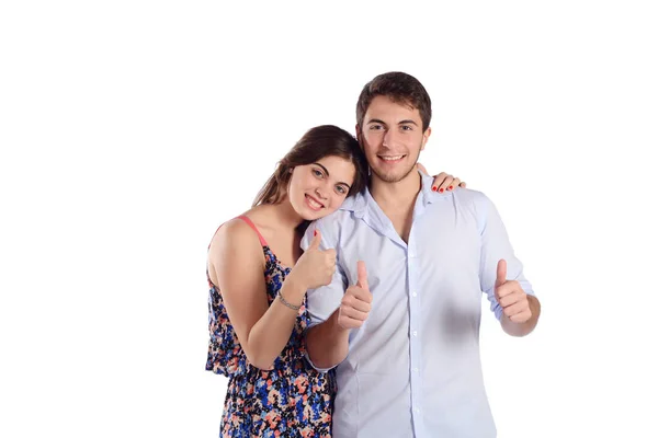 Young couple with thumbs up. — Stock Photo, Image