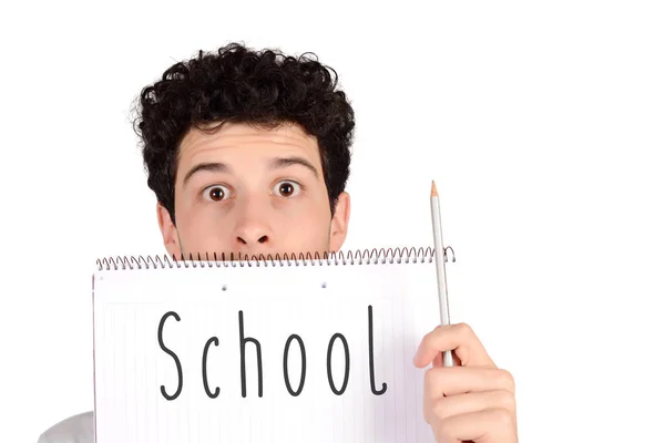 Aluno segurando lápis e caderno com texto "De volta à escola ". — Fotografia de Stock