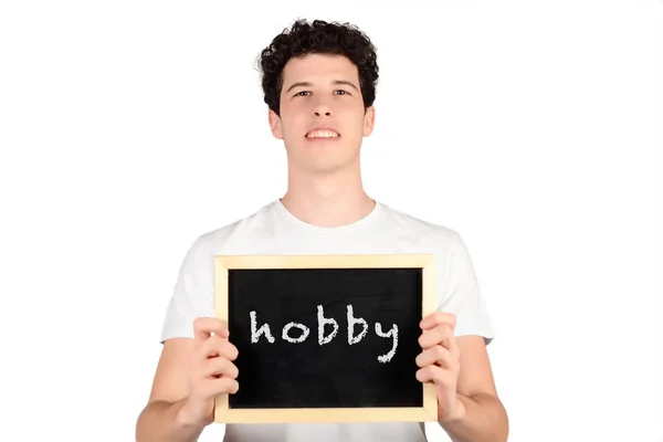 Człowiek posiadający tablica z tekstem "hobby". — Zdjęcie stockowe