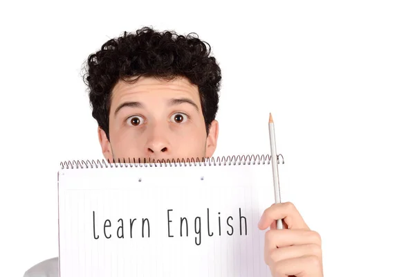 Студент держит блокнот и карандаш с текстом "выучите английский" — стоковое фото