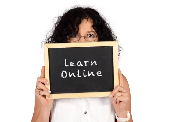 School teacher holding chalkboard with "learn online" text. — Stock Photo, Image