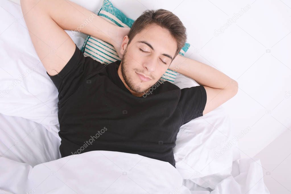 Man sleeping on bed.