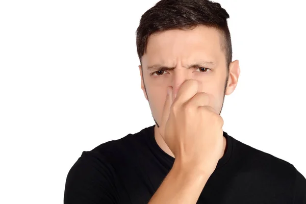 Hombre sosteniendo la nariz contra el mal olor . —  Fotos de Stock