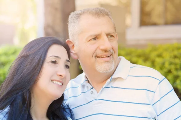 Portrait of smiling middle-aged couple looking forward — Stock Photo, Image