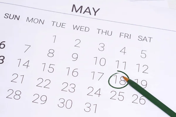 May Calendar with pen.