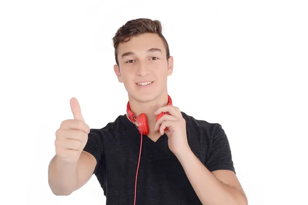 Retrato de adolescente sonriente escuchando música con auriculares —  Fotos de Stock