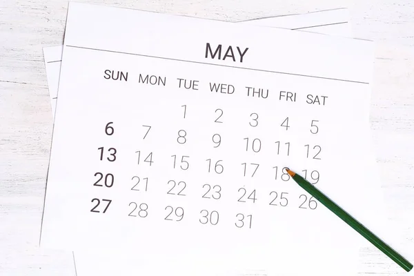 May Calendar with pen.
