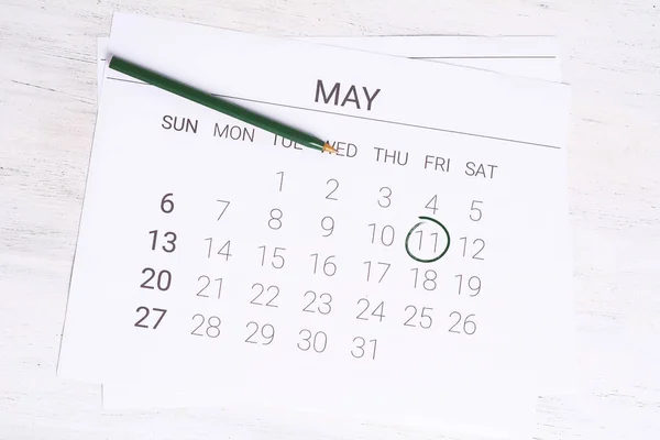 May Calendar with pen.