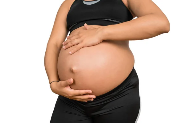 Mujer embarazada tocando su gran vientre. —  Fotos de Stock