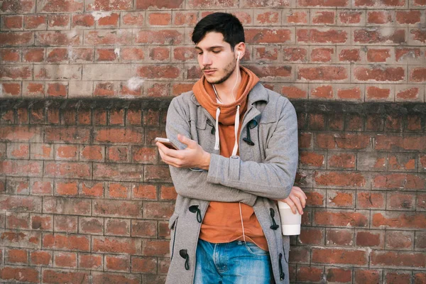 Young man using mobile phone.