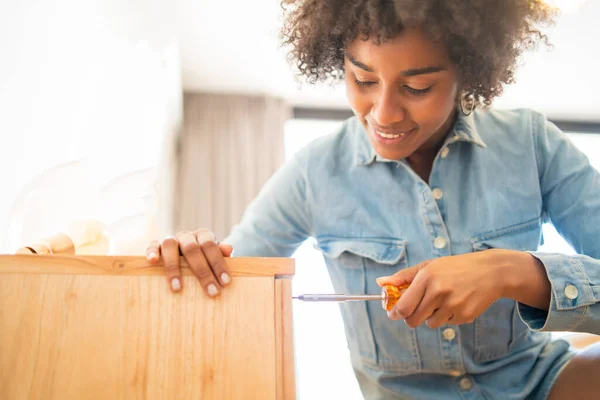 Portrait Young Afro Woman Repairing Furniture Screwdriver Home Repair Renovation — Stock Photo, Image