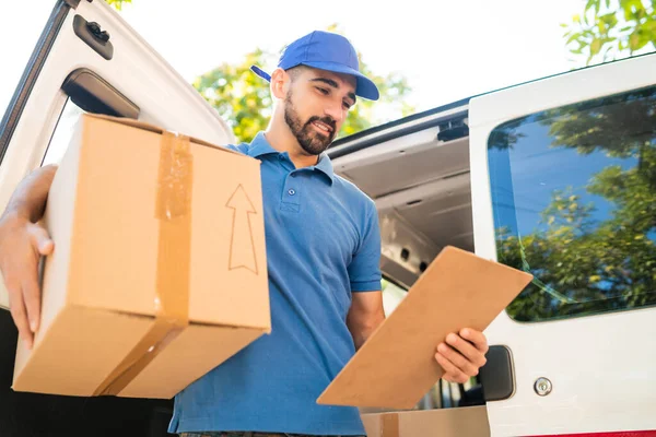 Portrait Delivery Man Unloading Cardboard Boxes Van Checking Clipboard List — Stock Photo, Image