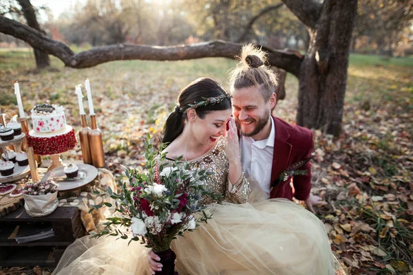 Bride couple at autumn park — Stock Photo, Image